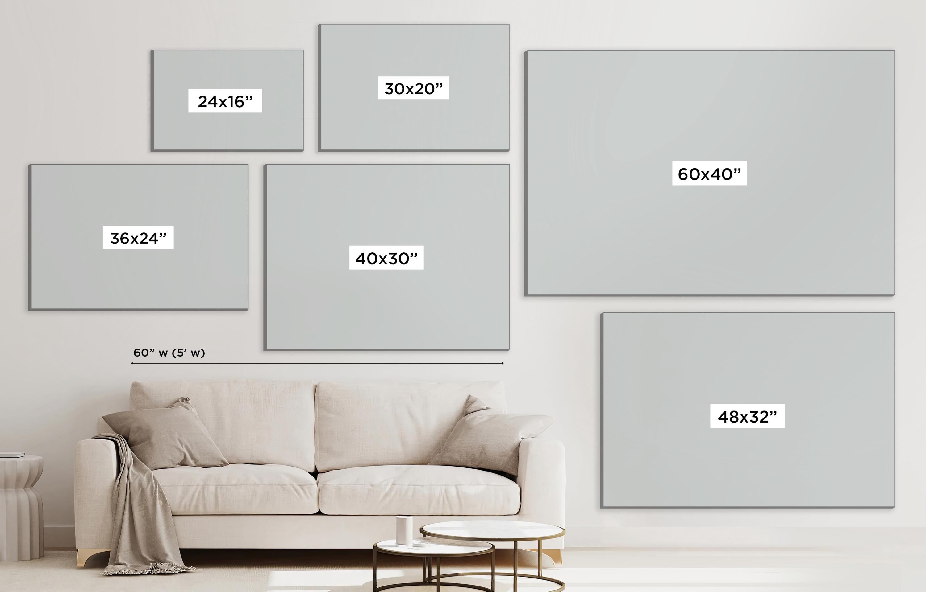 a living room with a white couch and a white wall
