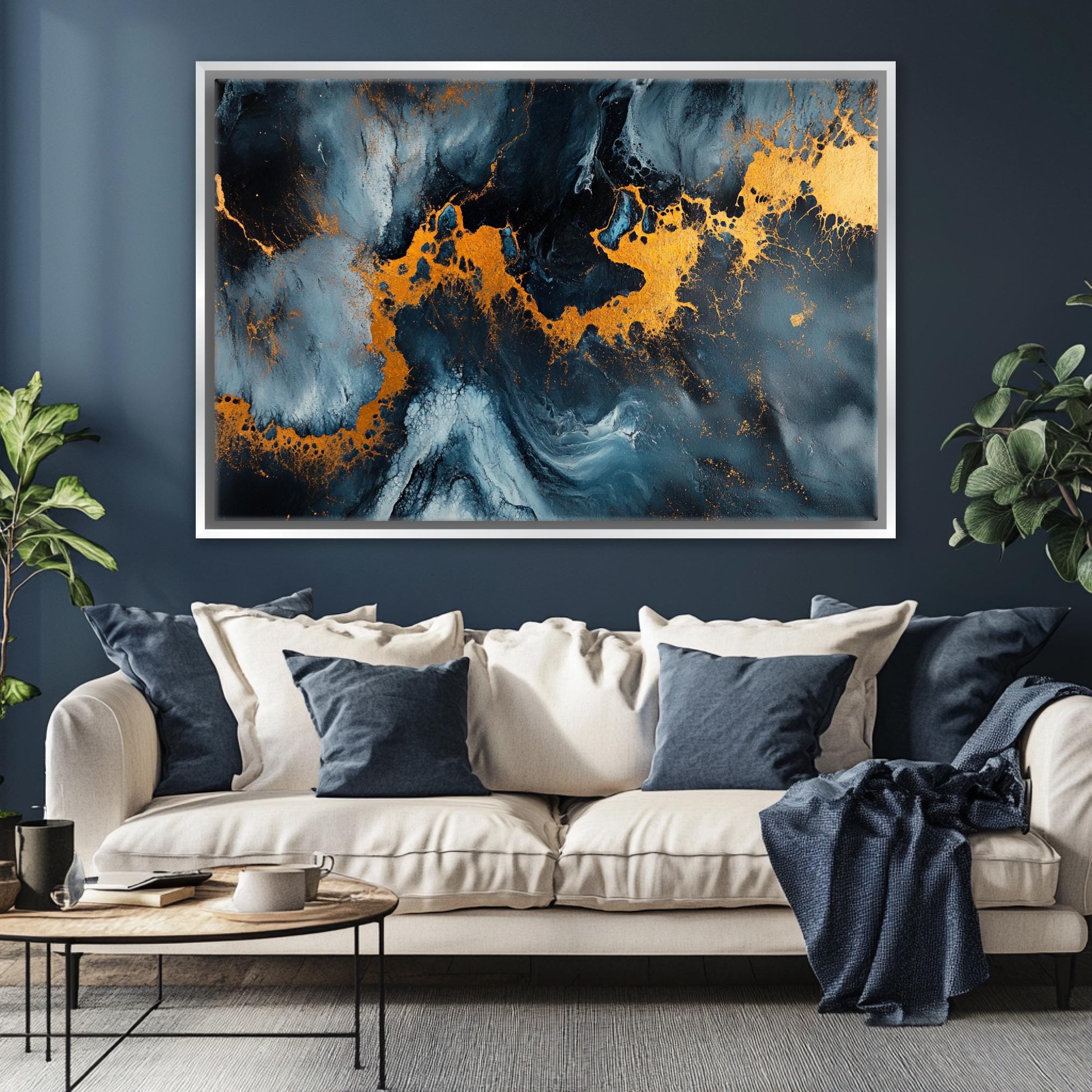 a living room with a couch and a painting on the wall