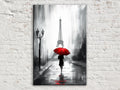 A black and white painting depicting a person walking on a rainy street, holding a red umbrella, with the Eiffel Tower in the background.