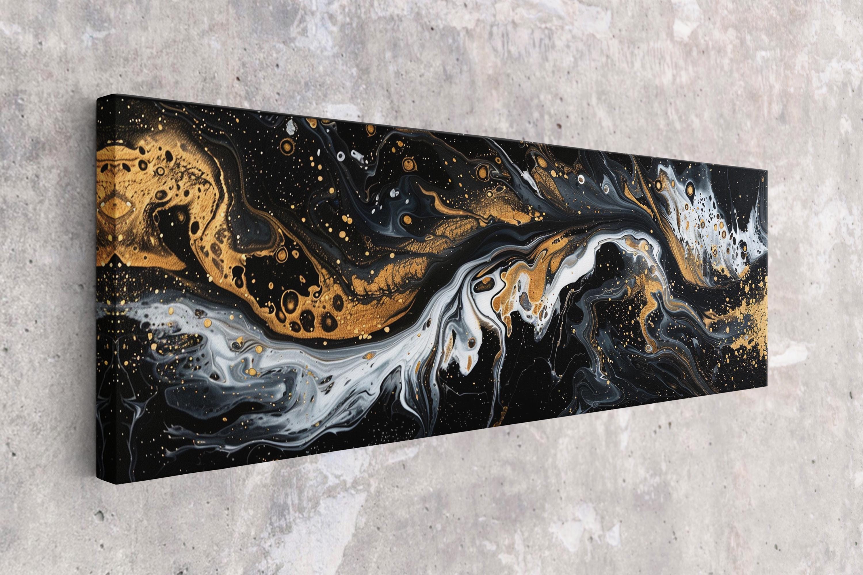 a black and gold painting on a wall