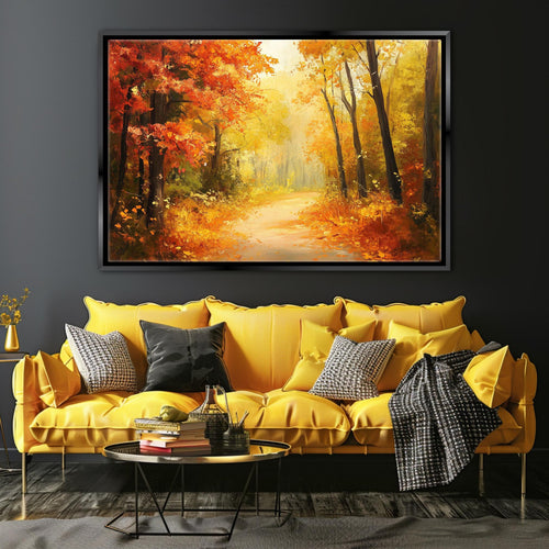 a large, vibrant painting of a forest path with autumn foliage hanging on a wall above a yellow sofa with throw pillows.