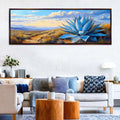 a living room with a couch and a painting on the wall