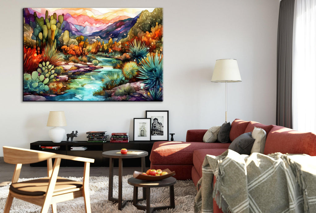a cozy living room with a large, colorful painting of a desert landscape hanging on the wall. The room is furnished with a red sofa, a wooden chair, and a coffee table with a bowl of fruit. The overall atmosphere of the room is warm and inviting, with the painting adding a vibrant touch to the space.
