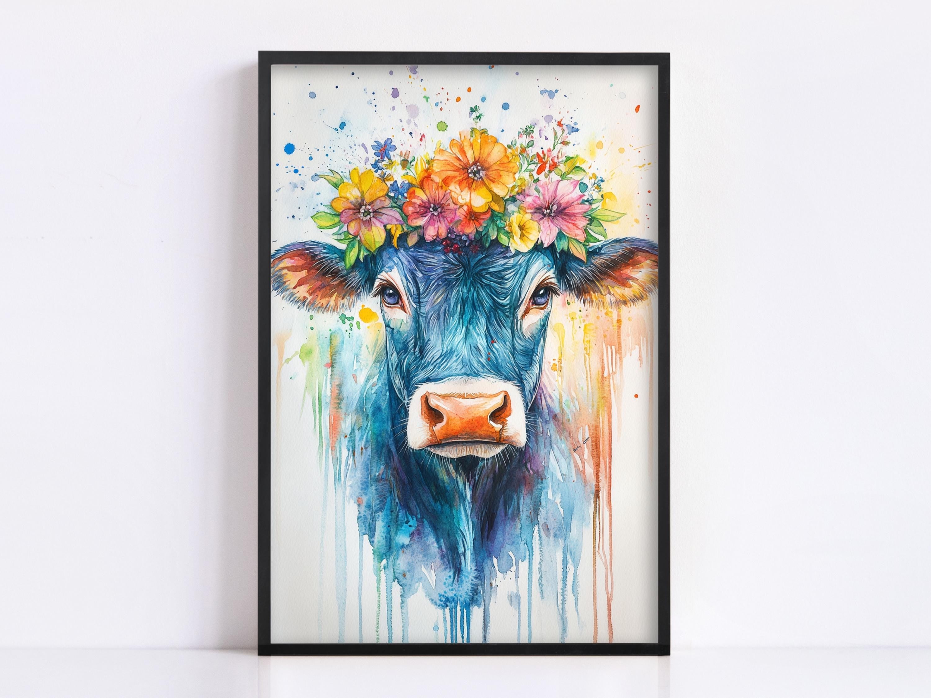 A framed painting depicting a blue cow with a colorful flower crown on its head.