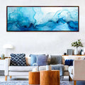 a living room filled with furniture and a painting on the wall