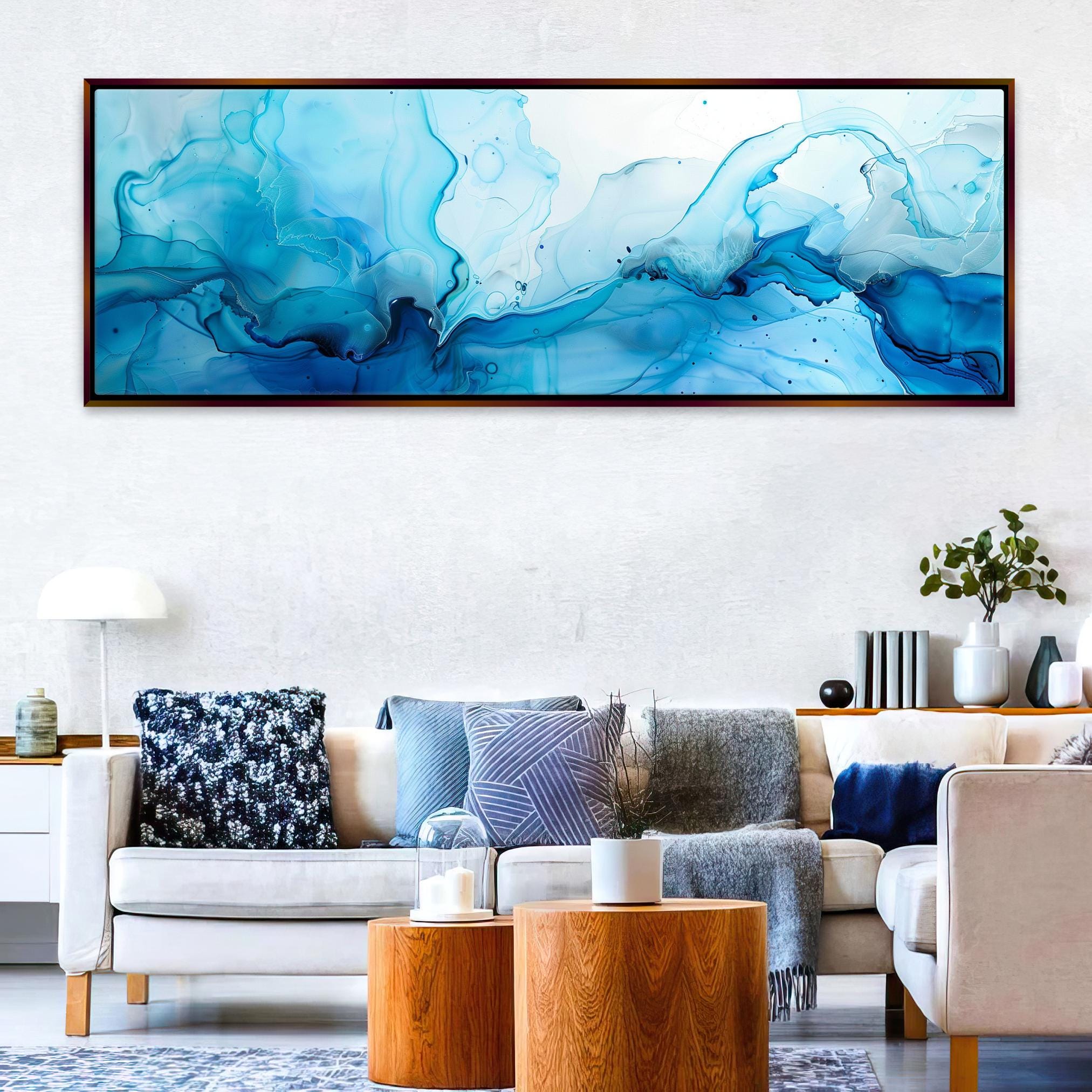 a living room filled with furniture and a painting on the wall
