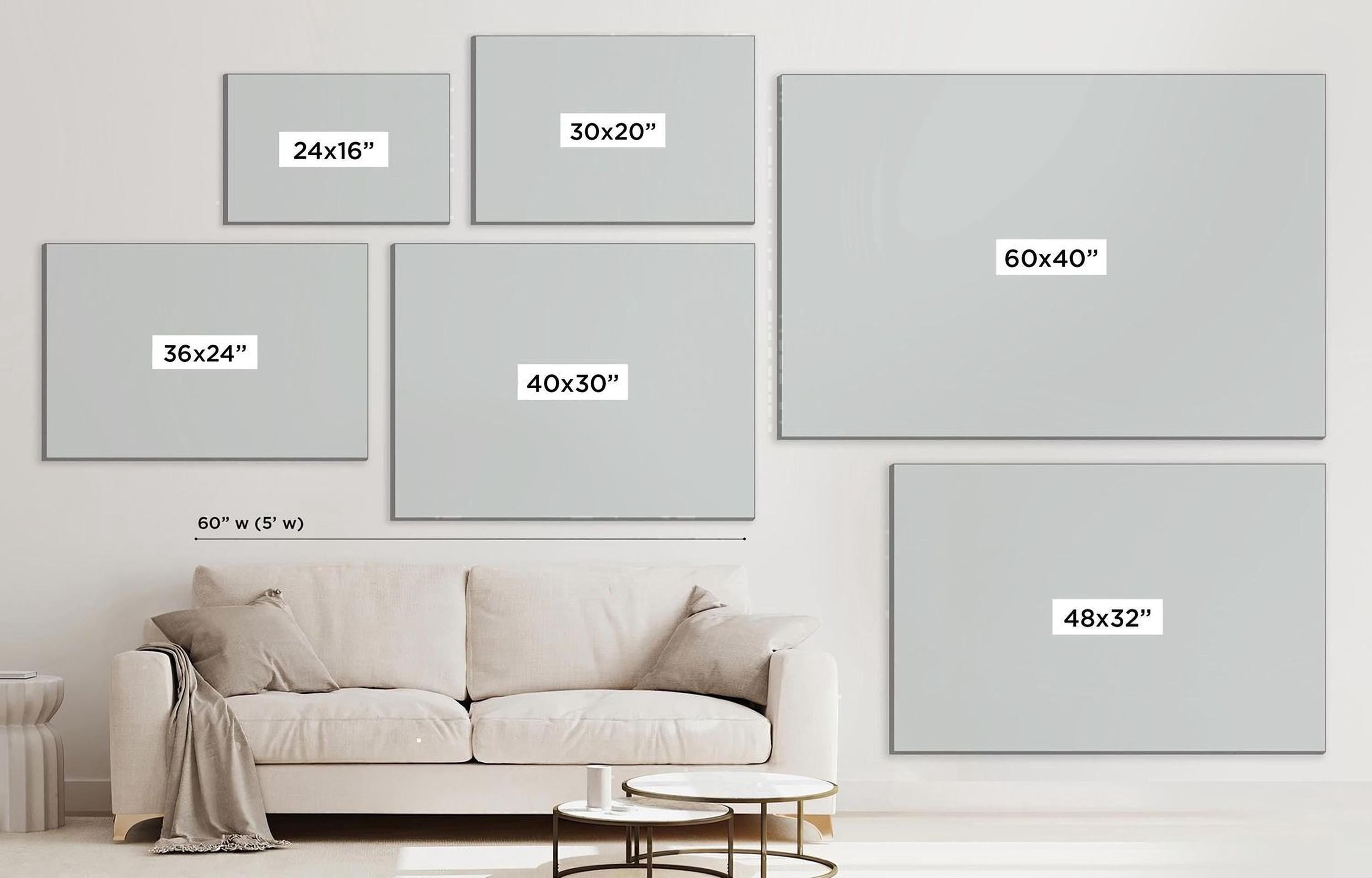a living room with a white couch and a white wall