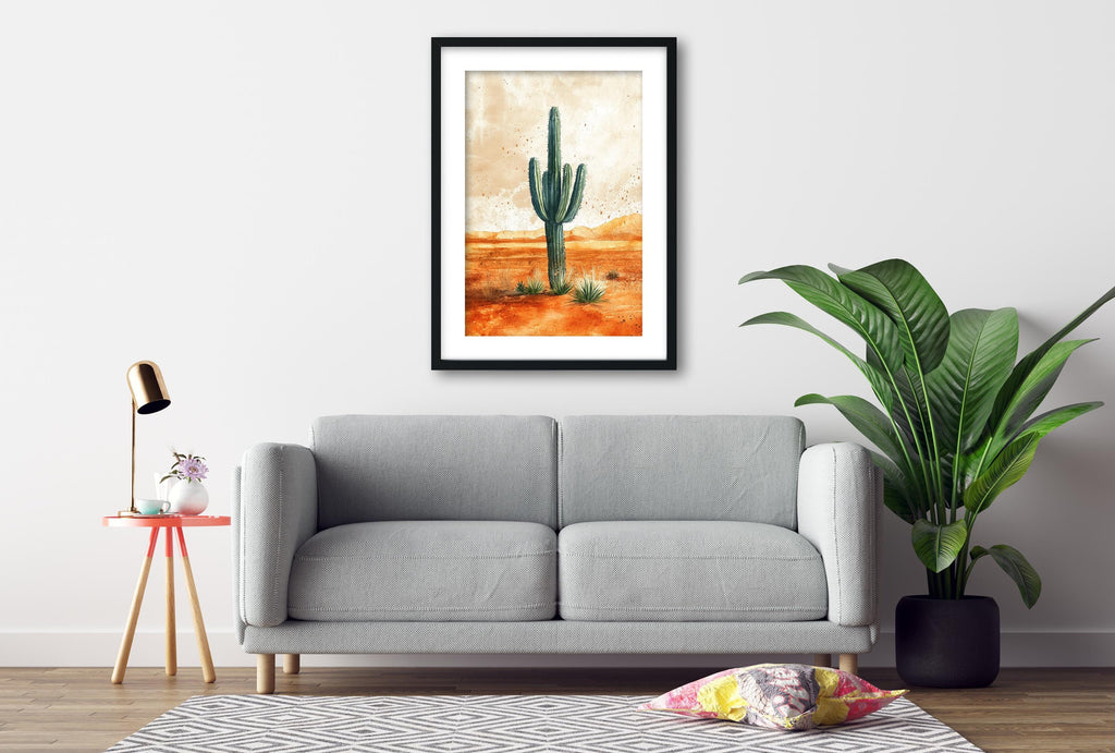 a gray sofa, a framed painting of a cactus, a small table with a lamp, and a potted plant, all arranged in a living room setting.