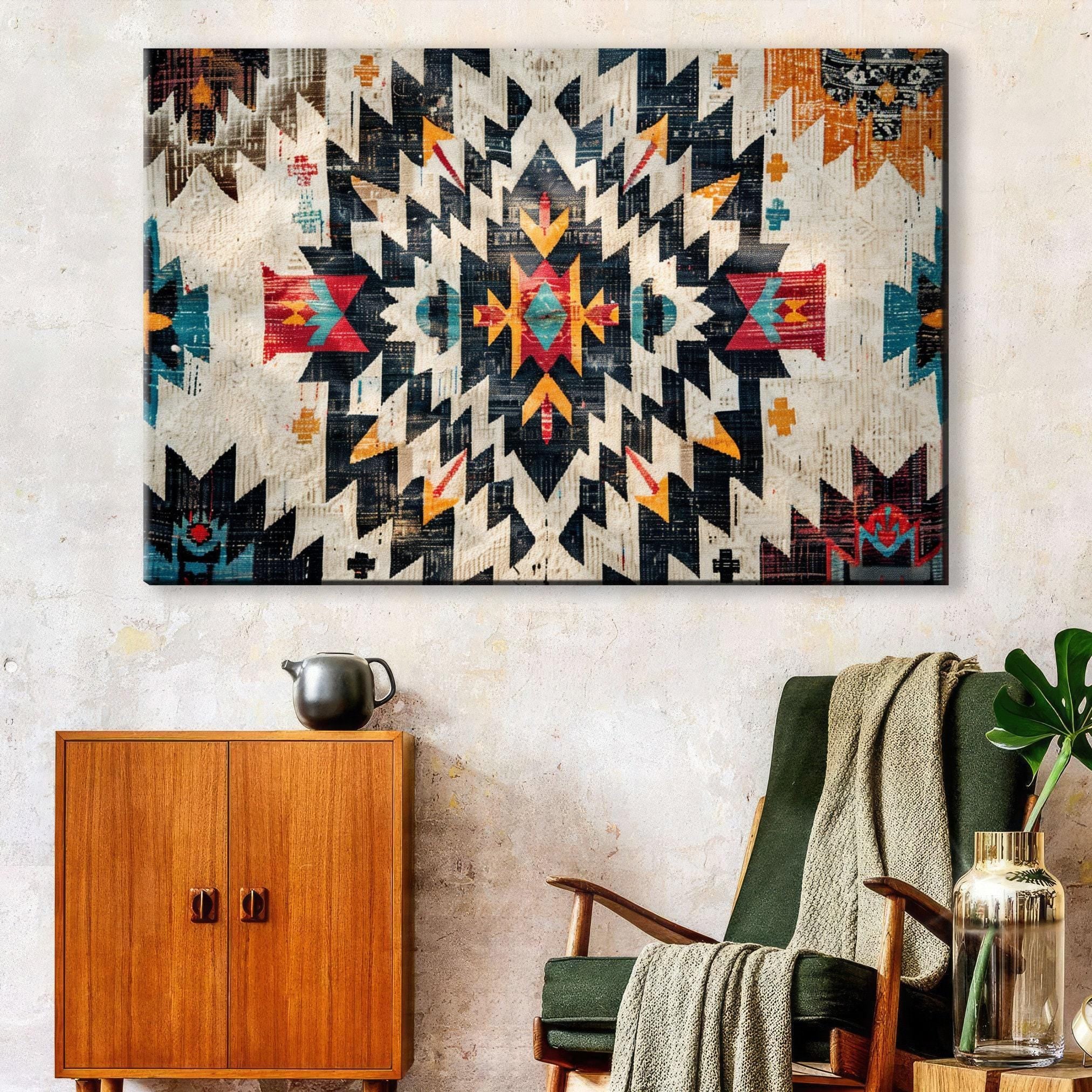 a large, colorful, abstract pattern on the wall, with a wooden cabinet below it and a green armchair in the foreground.