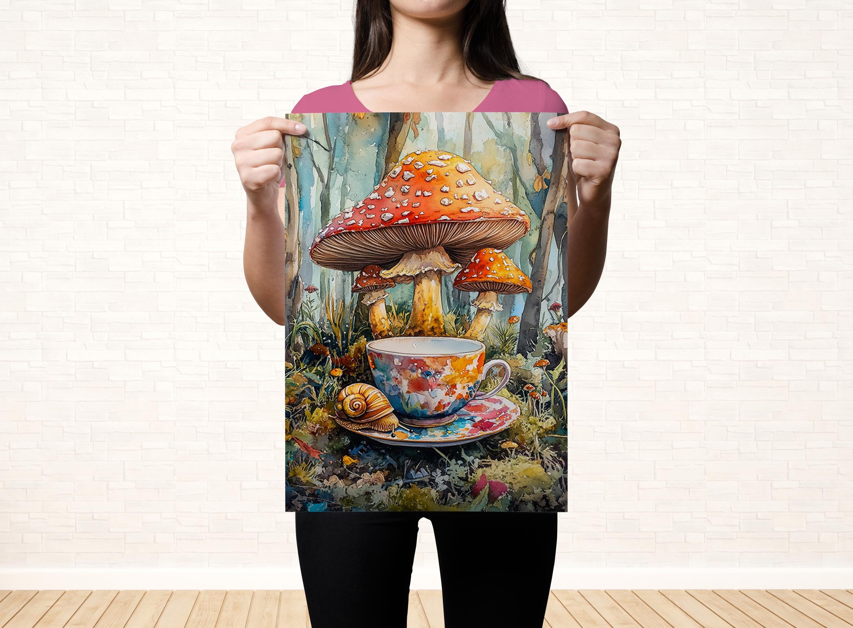 A woman holds up a colorful painting depicting a cup of tea surrounded by mushrooms and a snail, set against a forest-like background.