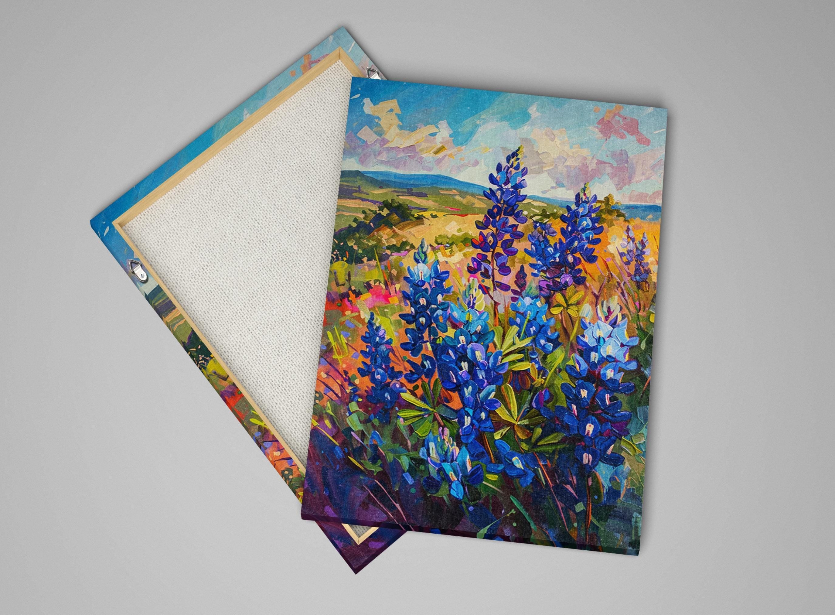 a vibrant painting of a field of colorful flowers, including blue and purple blooms, set against a backdrop of a picturesque landscape.