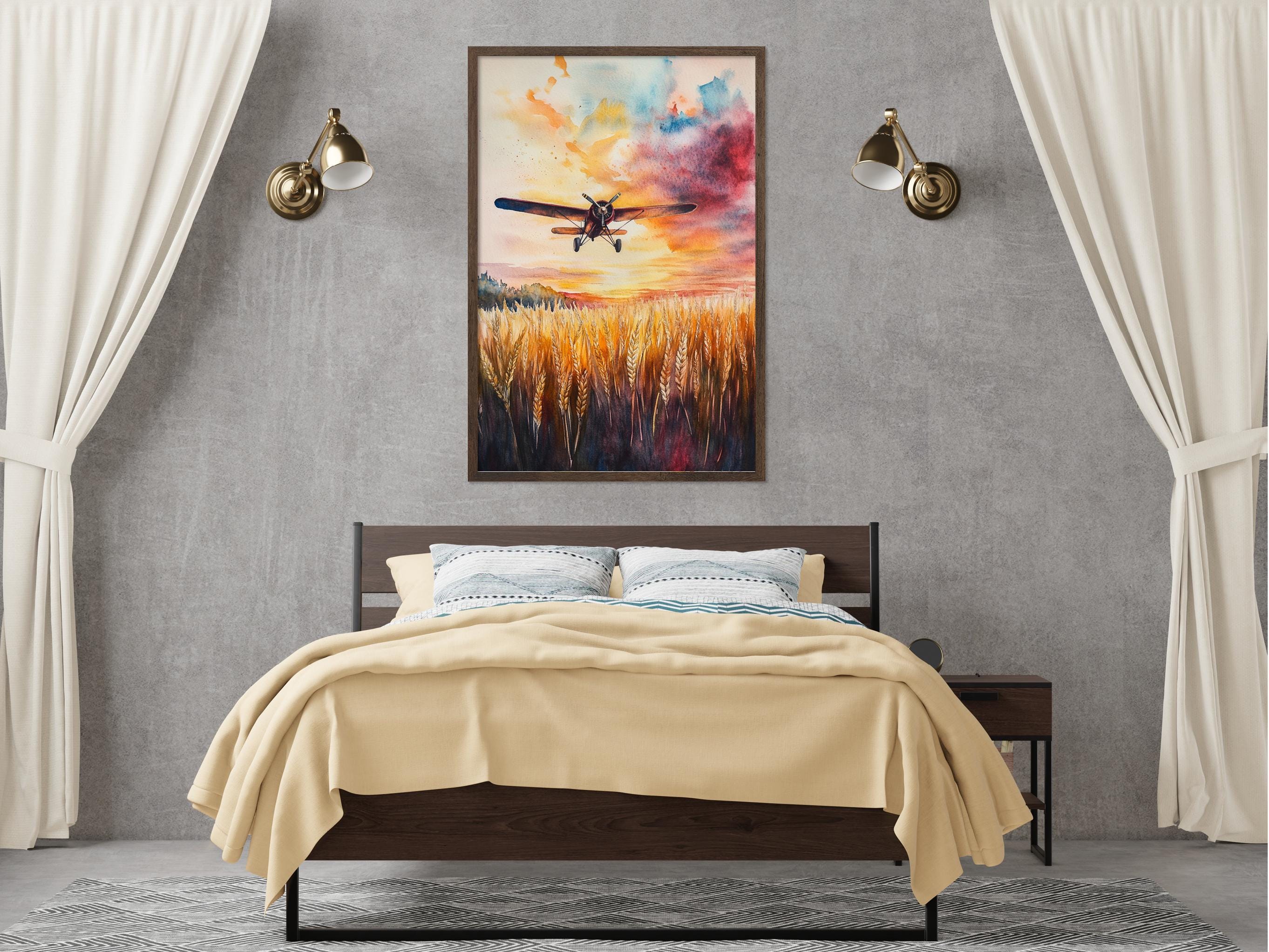 a bedroom with a large bed, a nightstand, and a painting of a plane flying over a field of wheat hanging on the wall above the bed.