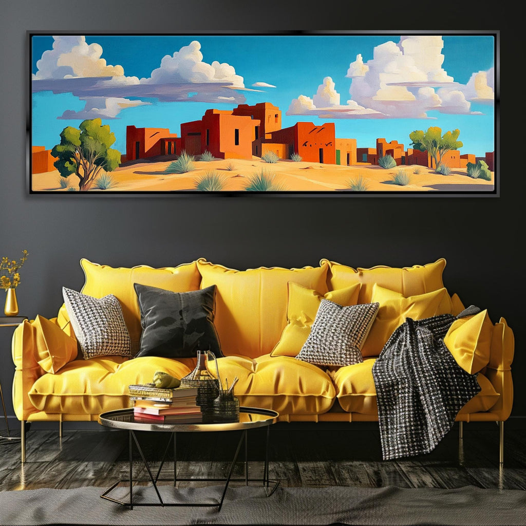 a living room with a yellow couch and a painting on the wall