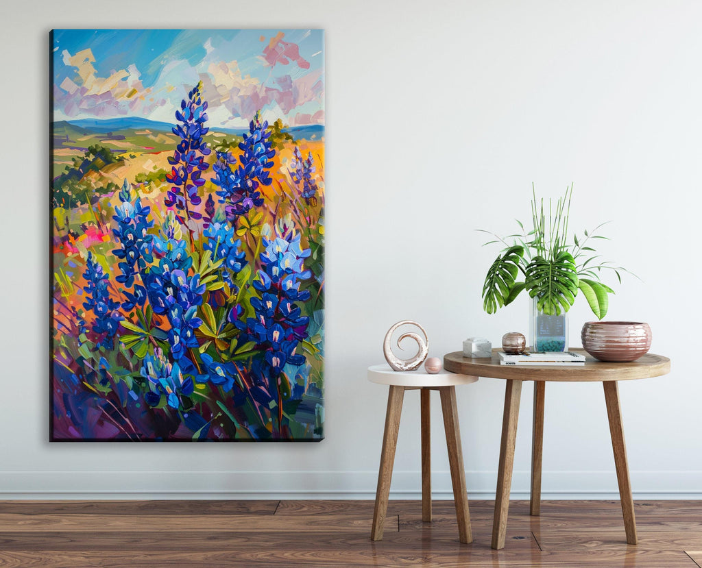 a large painting of a field of blue flowers on the wall, with a small round table and a potted plant in the foreground.