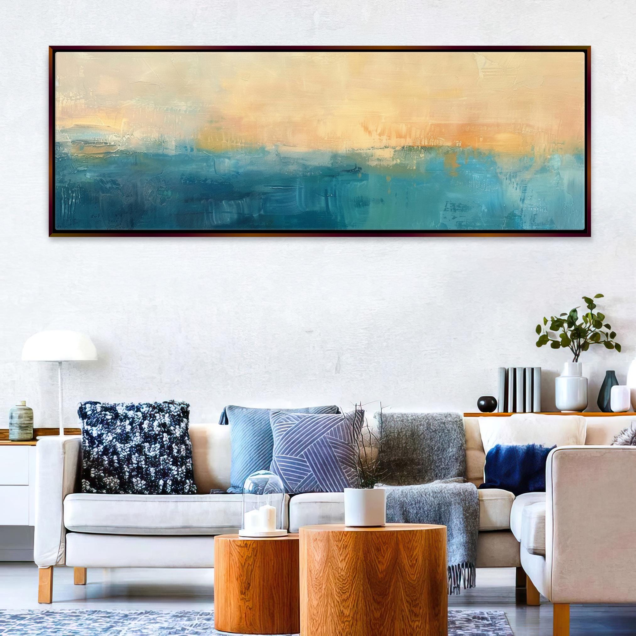 a living room filled with furniture and a painting on the wall
