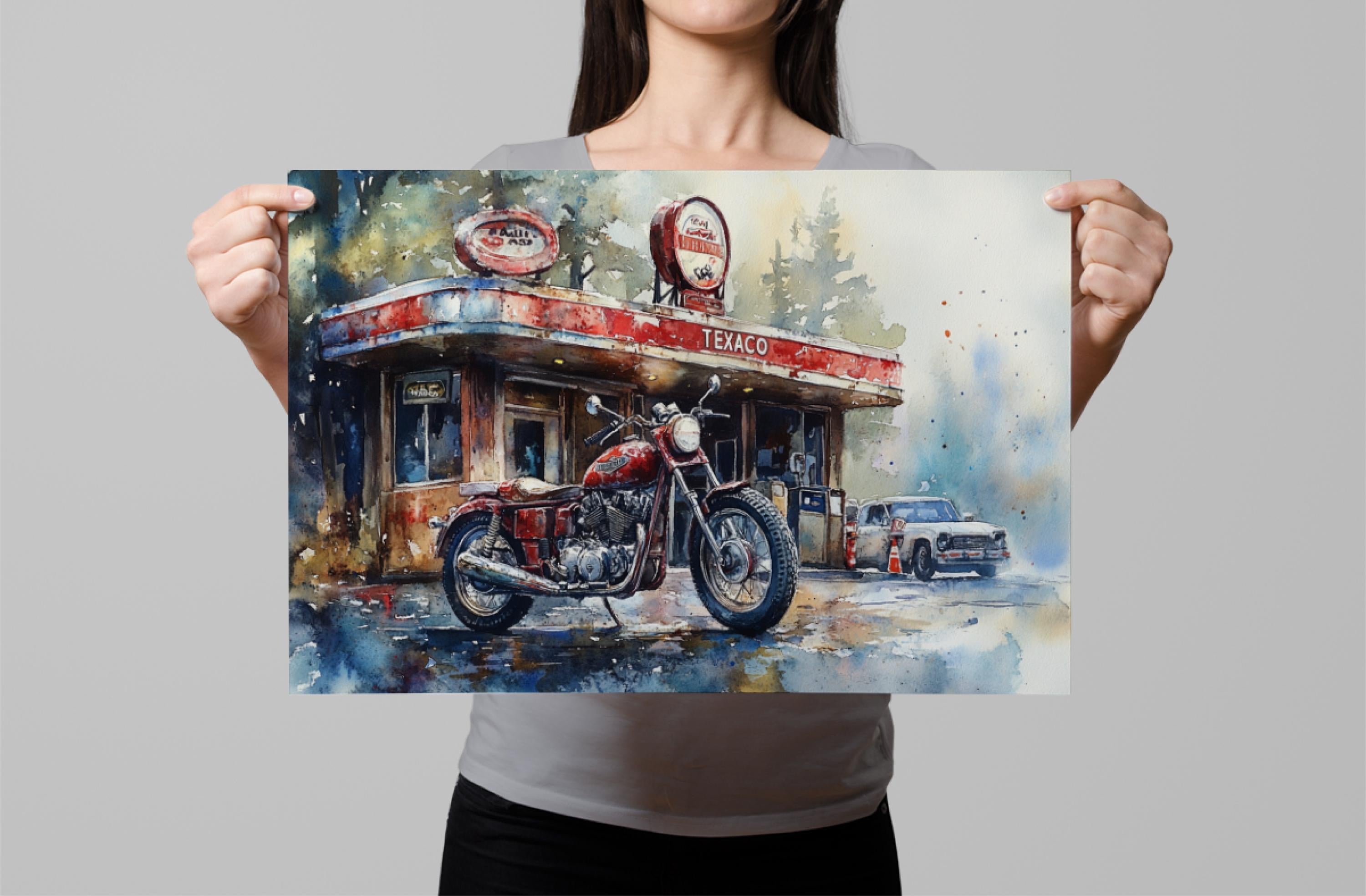 A woman holds up a framed painting depicting a red motorcycle parked in front of a gas station.