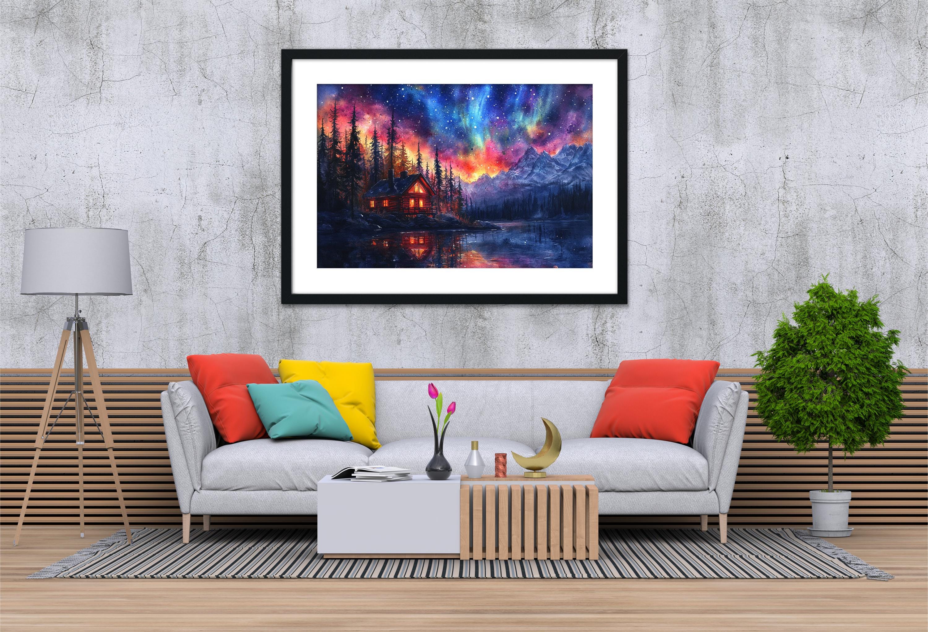 a cozy living room with a gray sofa adorned with colorful pillows, a wooden coffee table, and a framed painting of a serene mountain landscape hanging on the wall above the sofa.