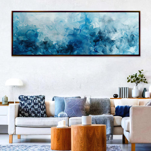 a living room filled with furniture and a painting on the wall