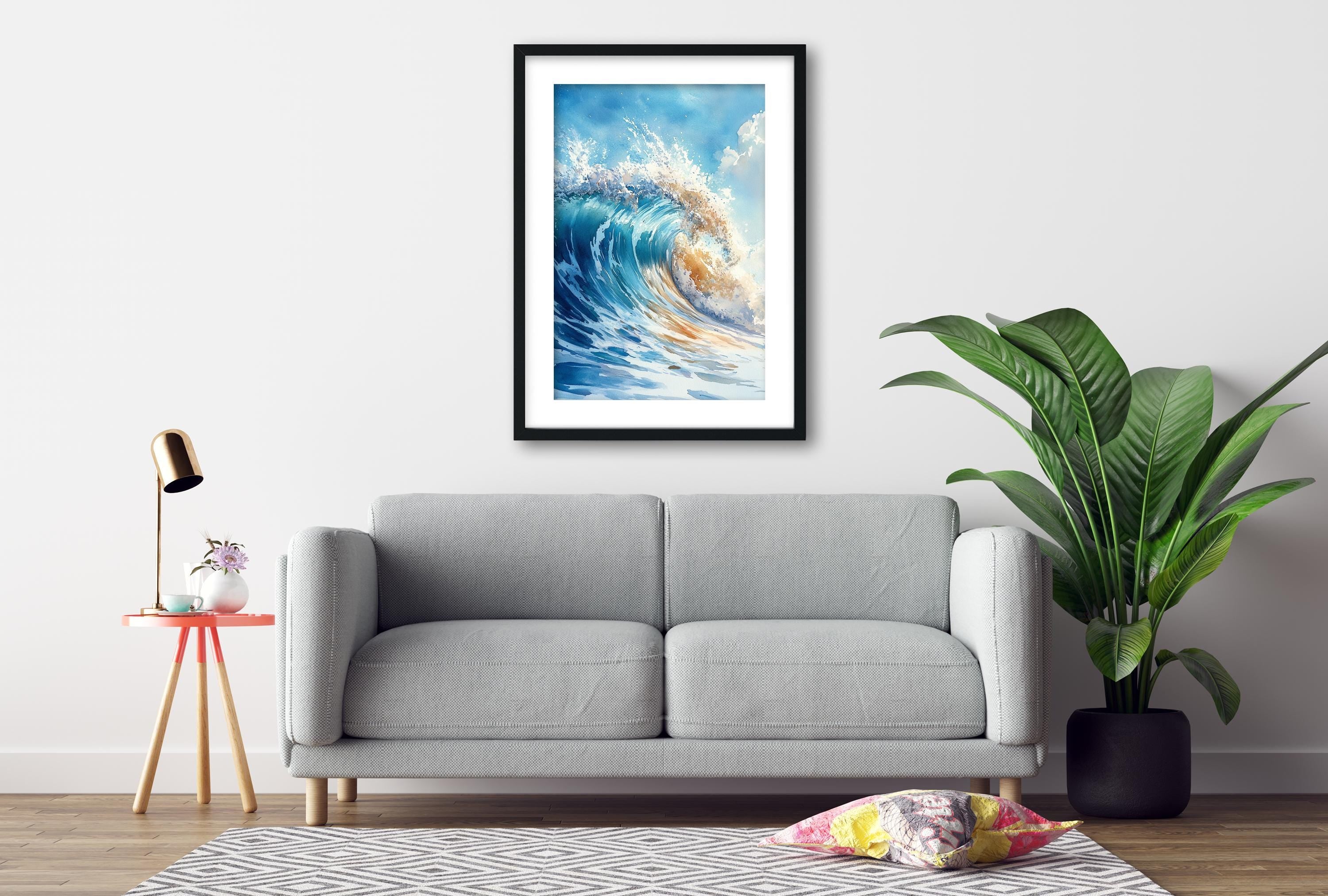 a gray sofa, a framed picture of a crashing wave, a small table with a lamp, and a potted plant, all arranged in a living room setting.