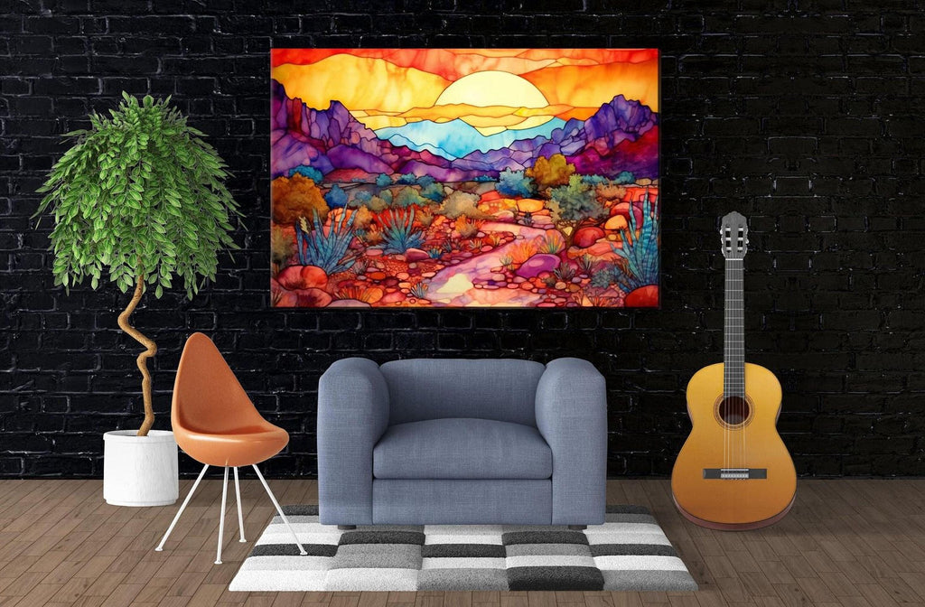 a modern living room with a large, colorful painting of a desert landscape hanging on the wall. The painting is vibrant with warm hues of orange, yellow, and red, depicting a desert scene with mountains, cacti, and a winding path. The room is furnished with a gray armchair, a wooden chair, and a guitar, creating a cozy and inviting atmosphere.
