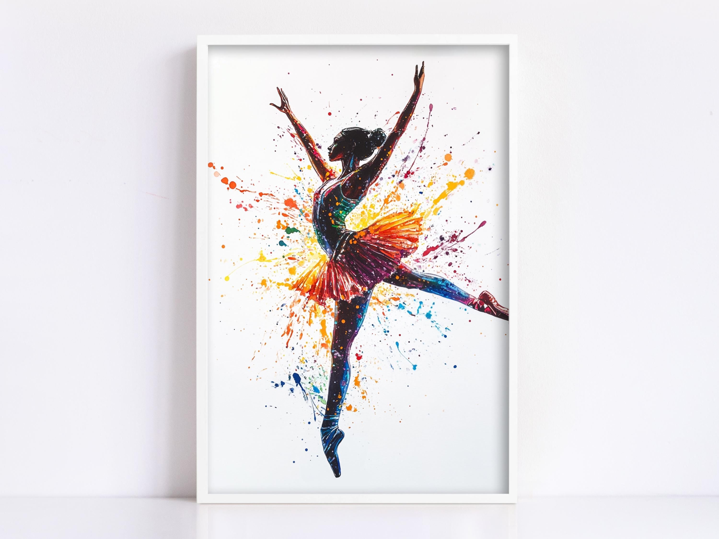 A framed painting depicting a ballerina in a dynamic pose, with her arms raised and surrounded by splashes of color.