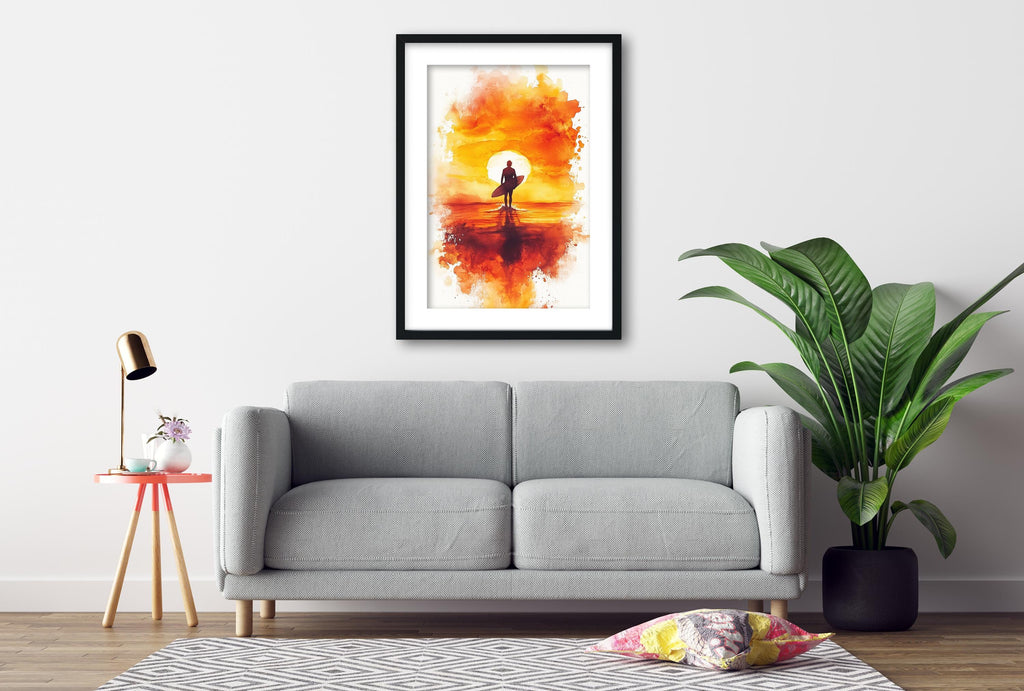 a gray sofa, a framed painting of a surfer on a sunset, a potted plant, and a small table with a lamp.
