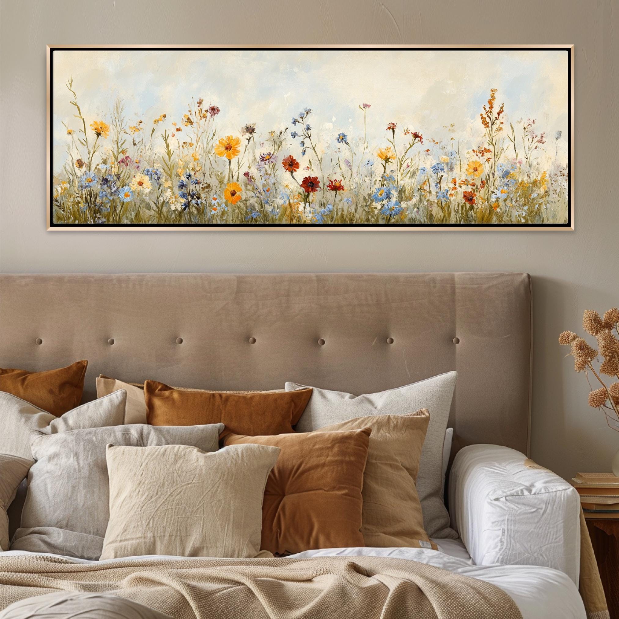a bed with a painting on the wall above it