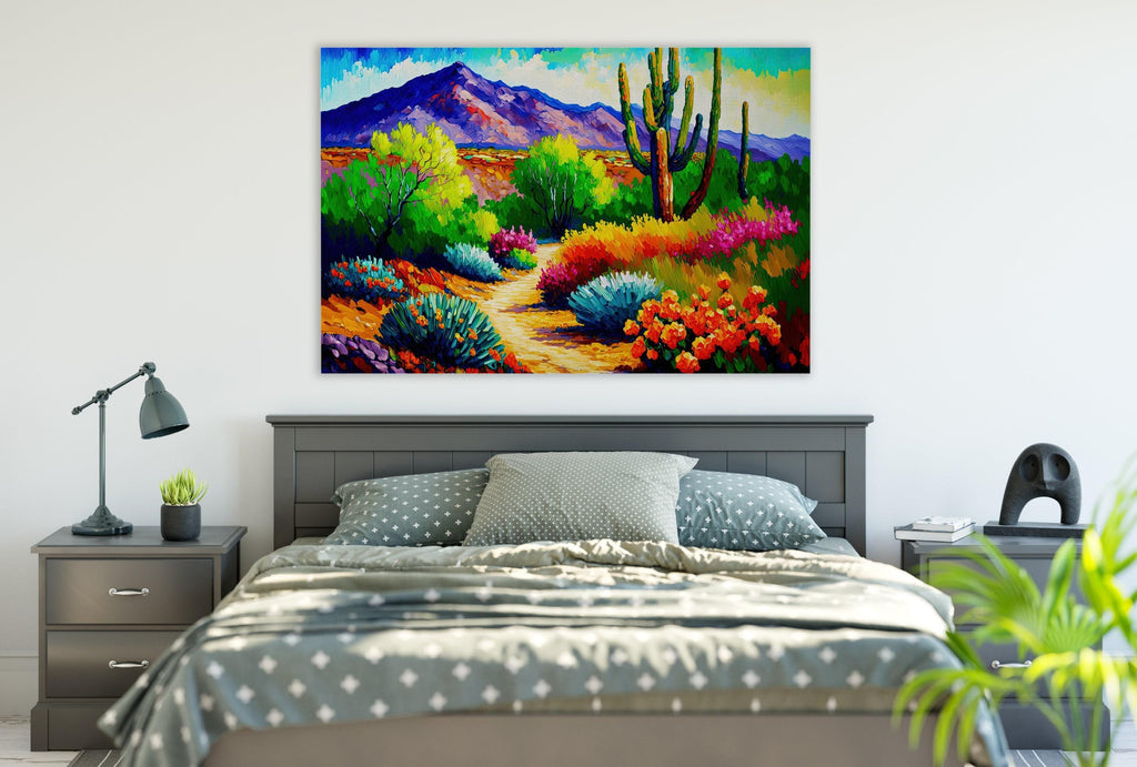 a bedroom with a large painting of a desert landscape hanging on the wall above a bed with a gray and white patterned bedspread.