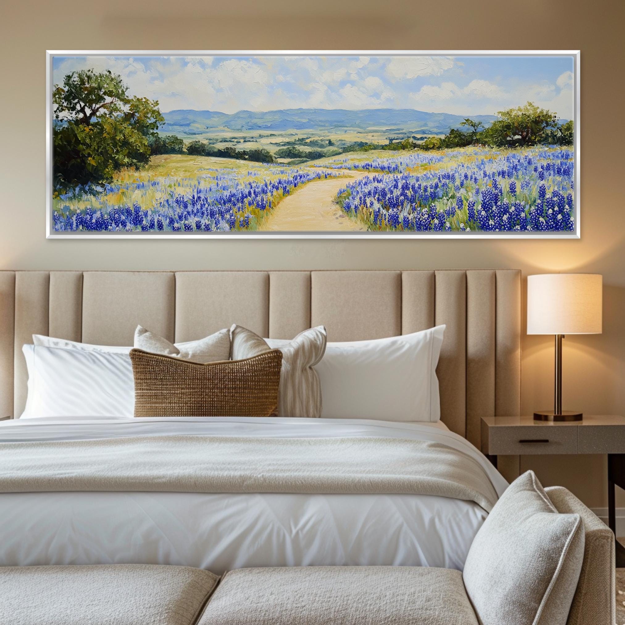 a bedroom with a large painting on the wall above the bed