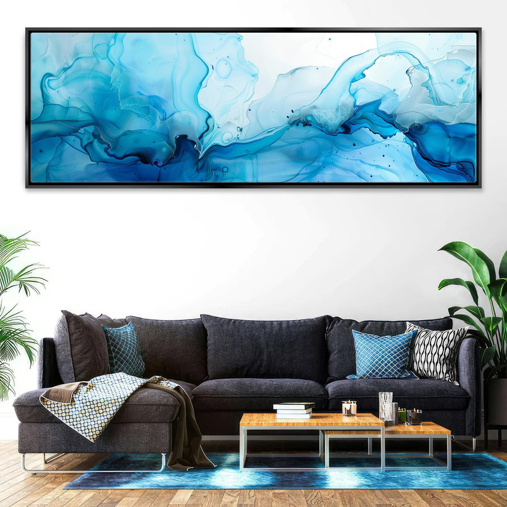 a living room with a couch and a painting on the wall