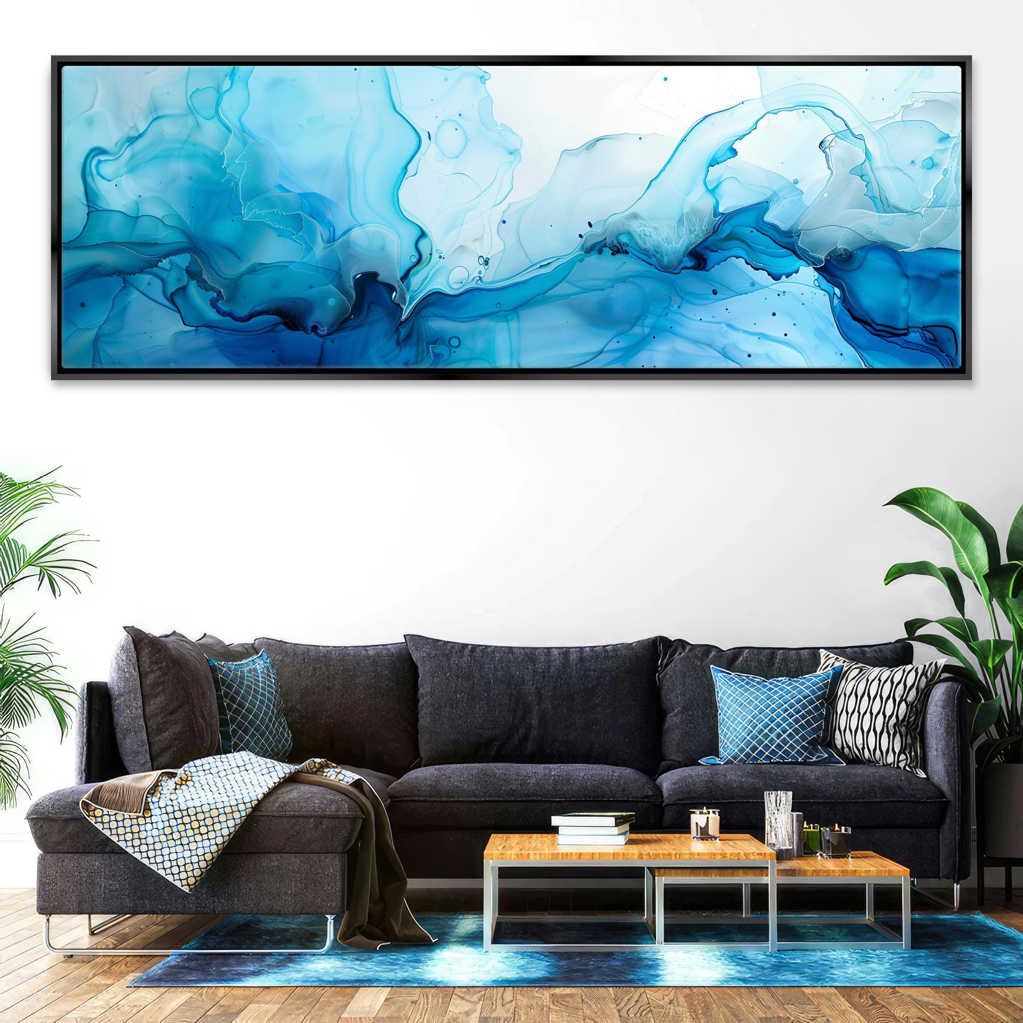 a living room with a couch and a painting on the wall