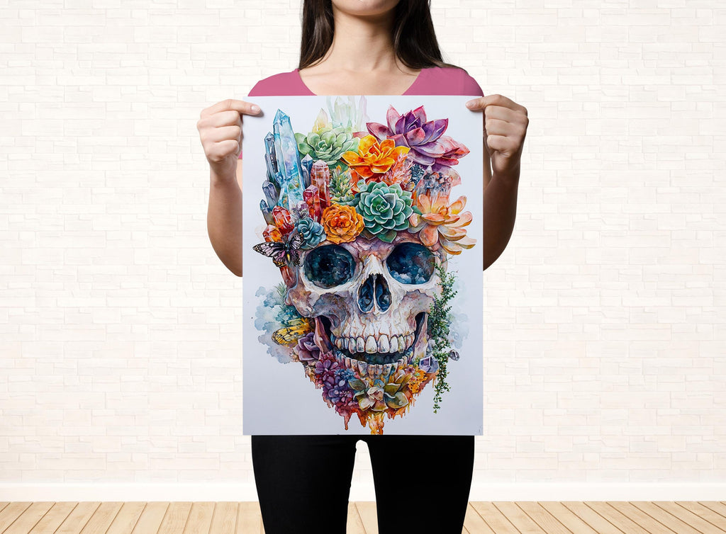 A woman holds up a colorful, artistic print of a skull with a floral design on it.
