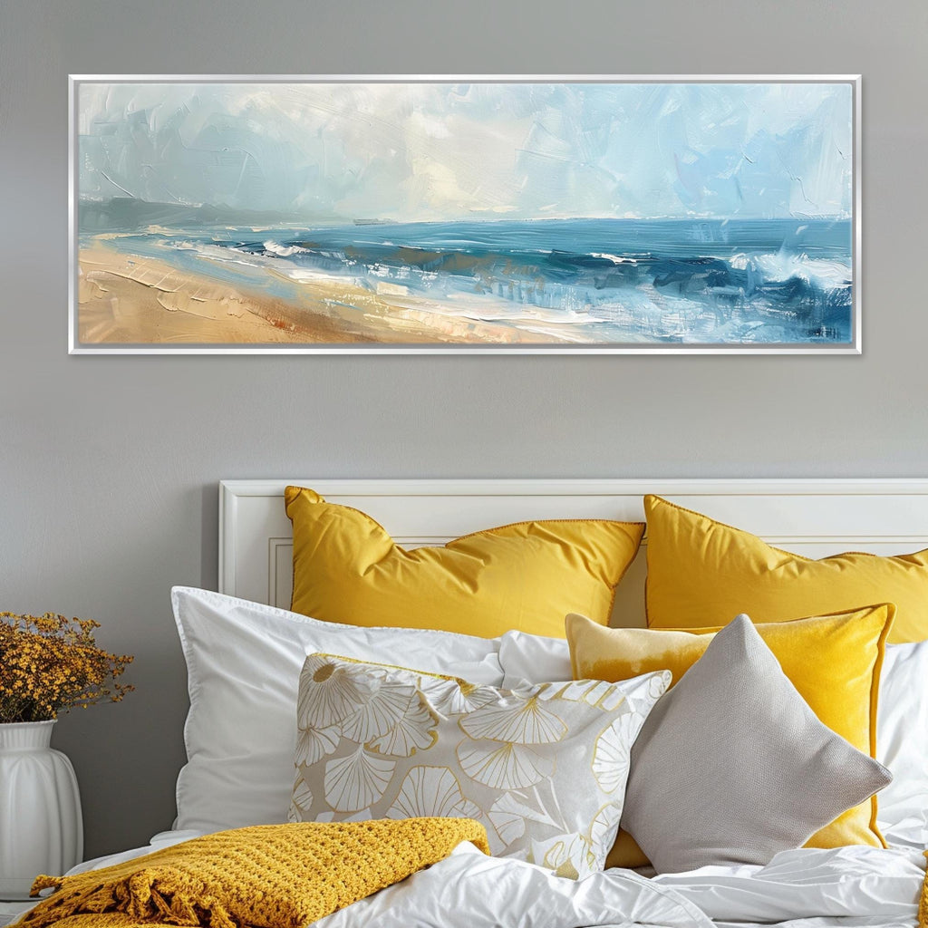 a bed with yellow pillows and a painting on the wall