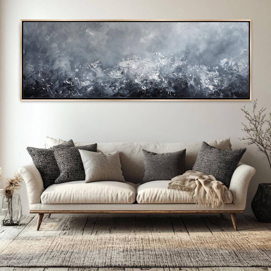 a living room with a couch and a painting on the wall