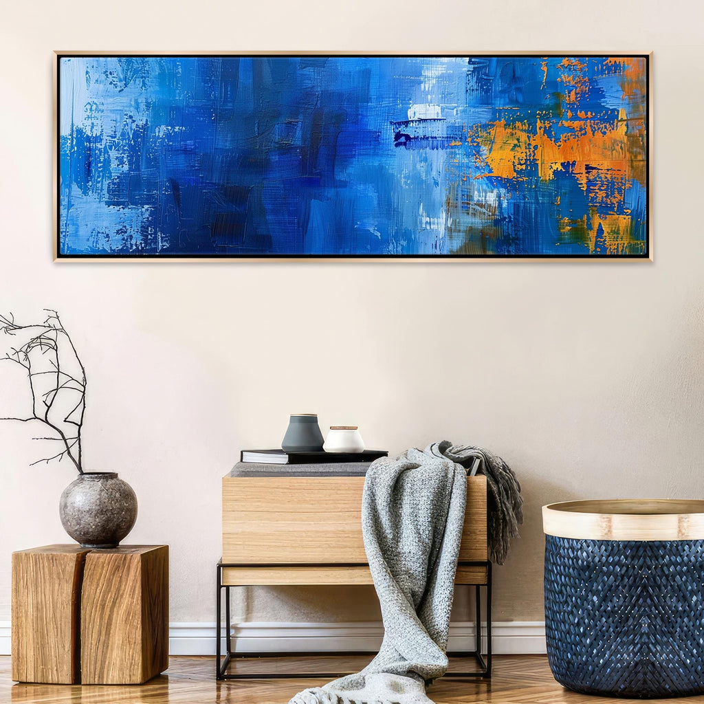 a living room with a blue painting on the wall
