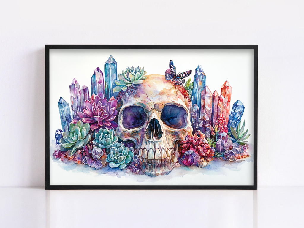 A framed watercolor painting depicting a skull surrounded by colorful crystals, succulents, and butterflies.