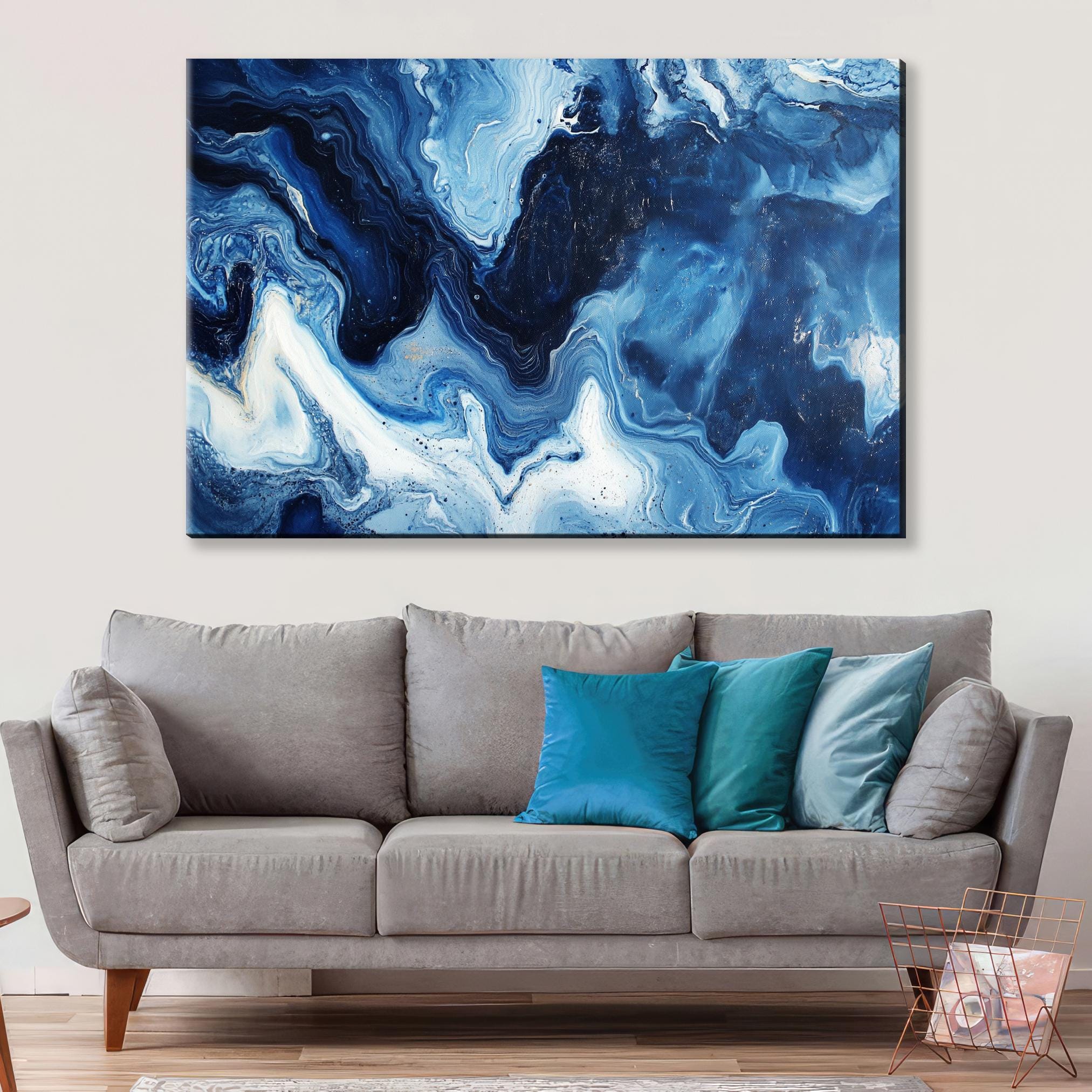 a living room with a couch and a painting on the wall