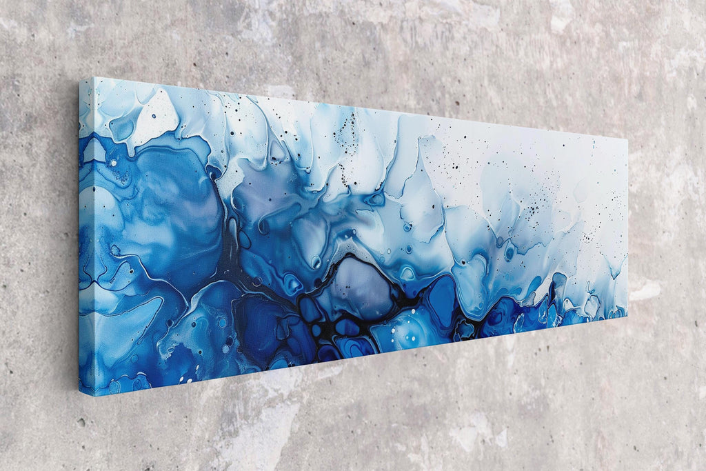 a blue and white abstract painting on a wall