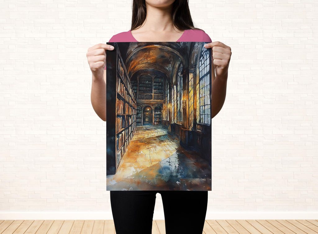 A woman holds up a framed painting depicting a grand library with rows of bookshelves and a high, arched ceiling.