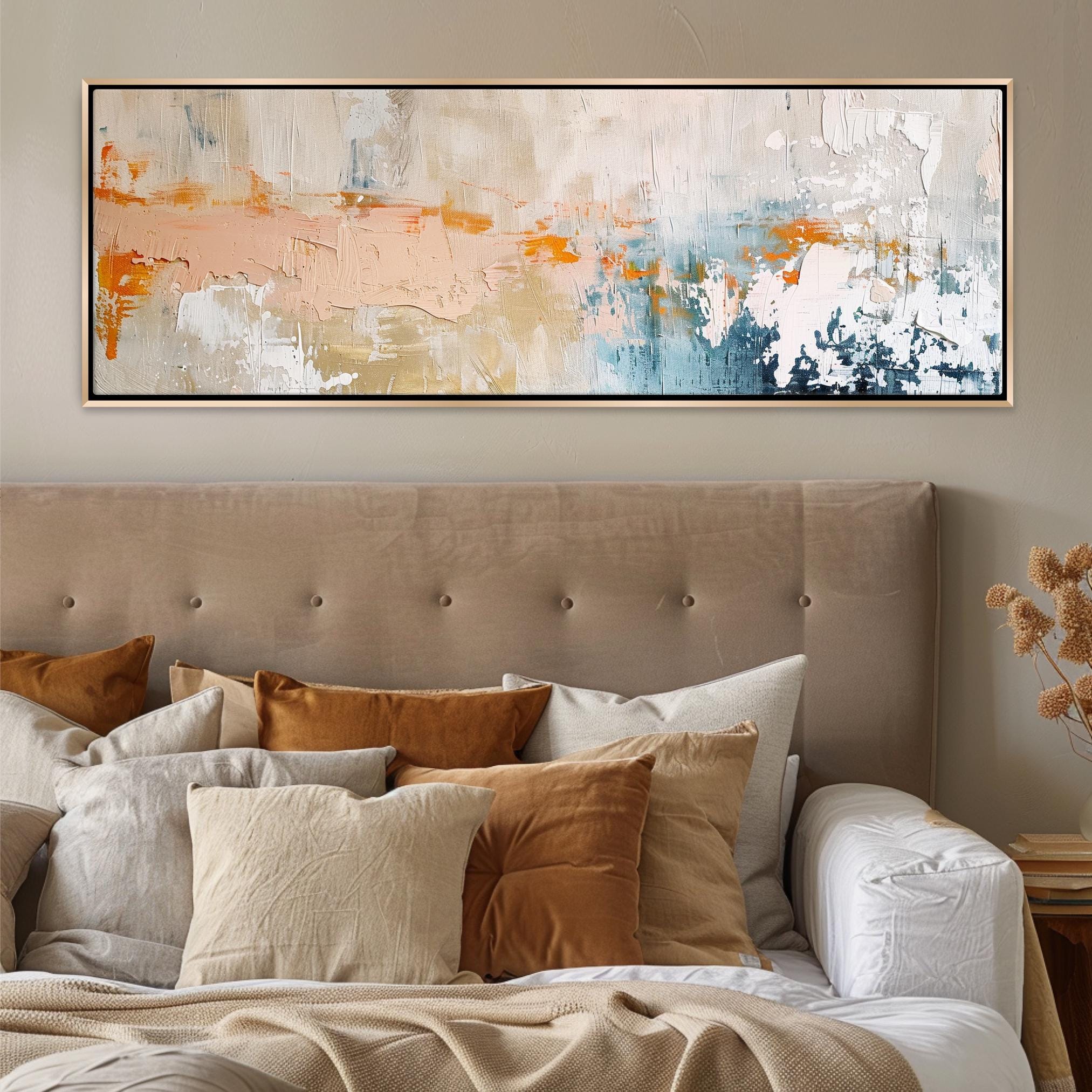 a bed with a large painting hanging above it