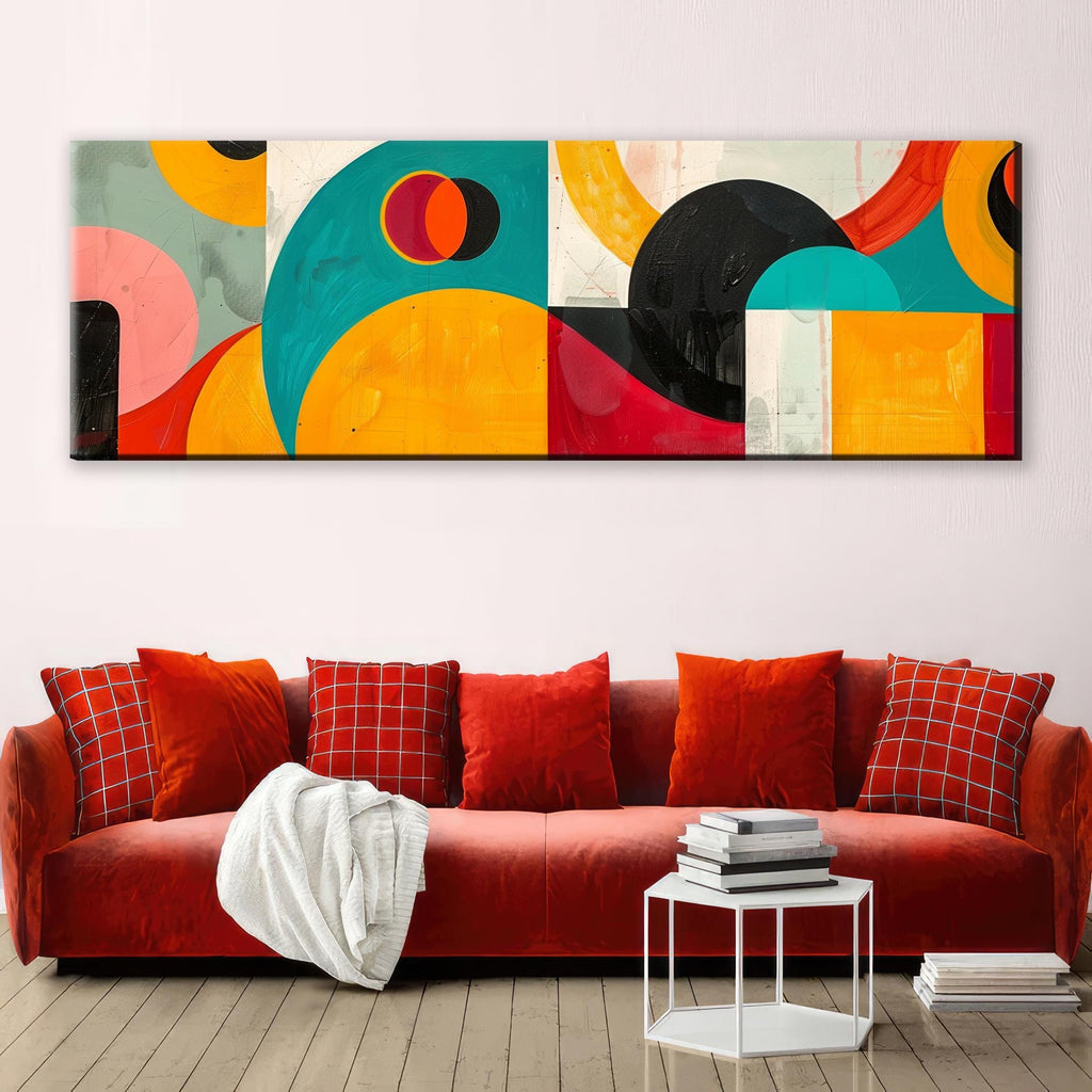 a living room with a red couch and a painting on the wall