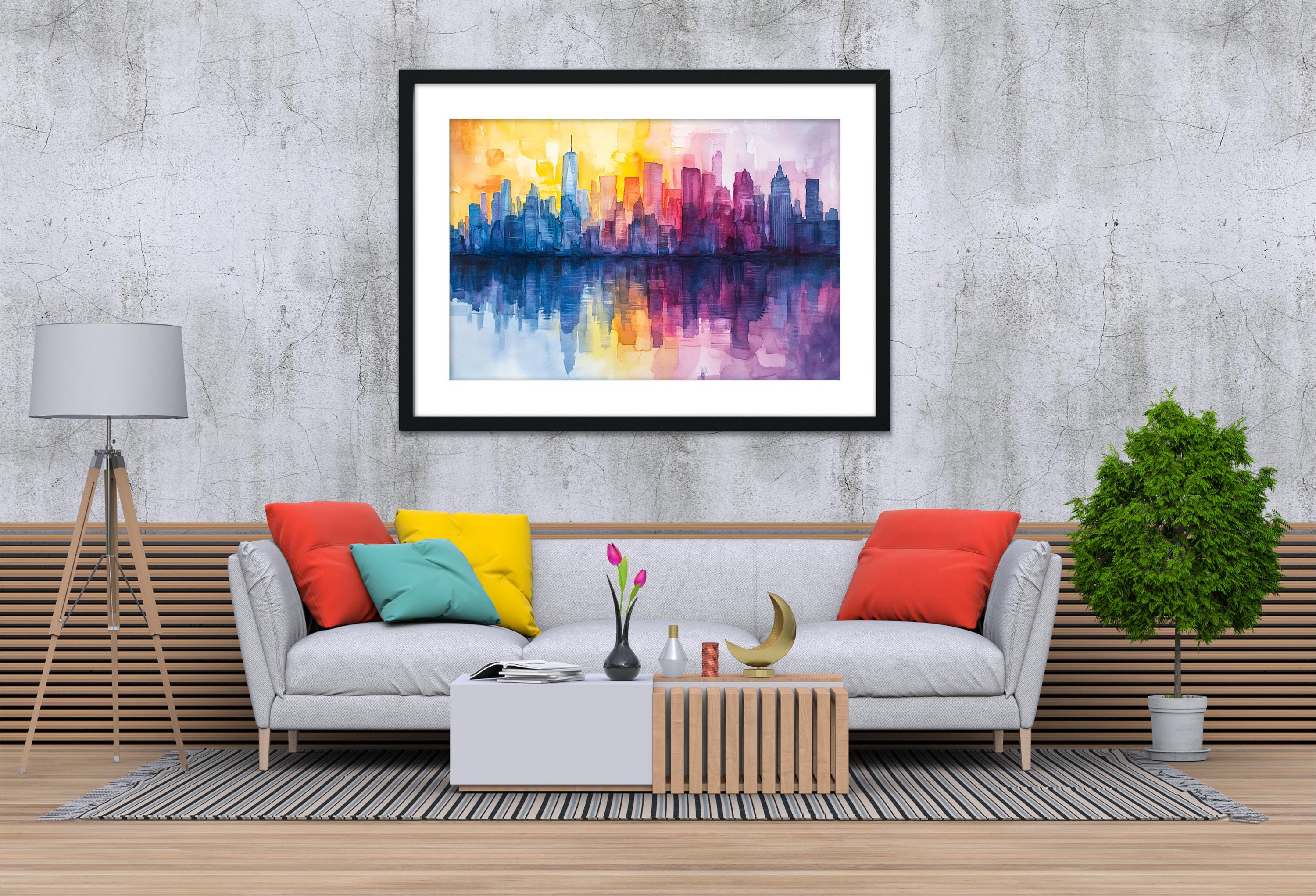 a modern living room with a gray sofa, a coffee table, and a framed painting of a city skyline hanging on the wall above the sofa.