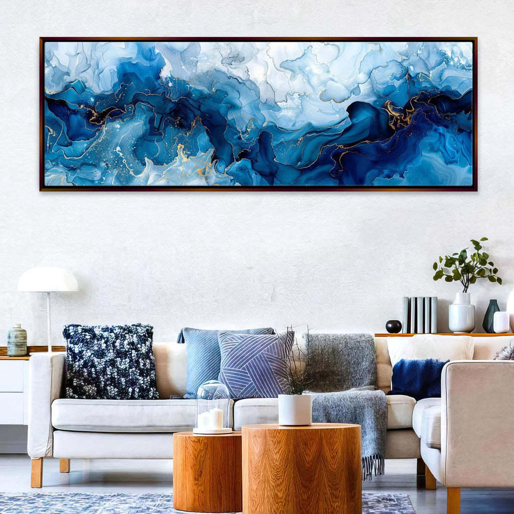 a living room filled with furniture and a painting on the wall