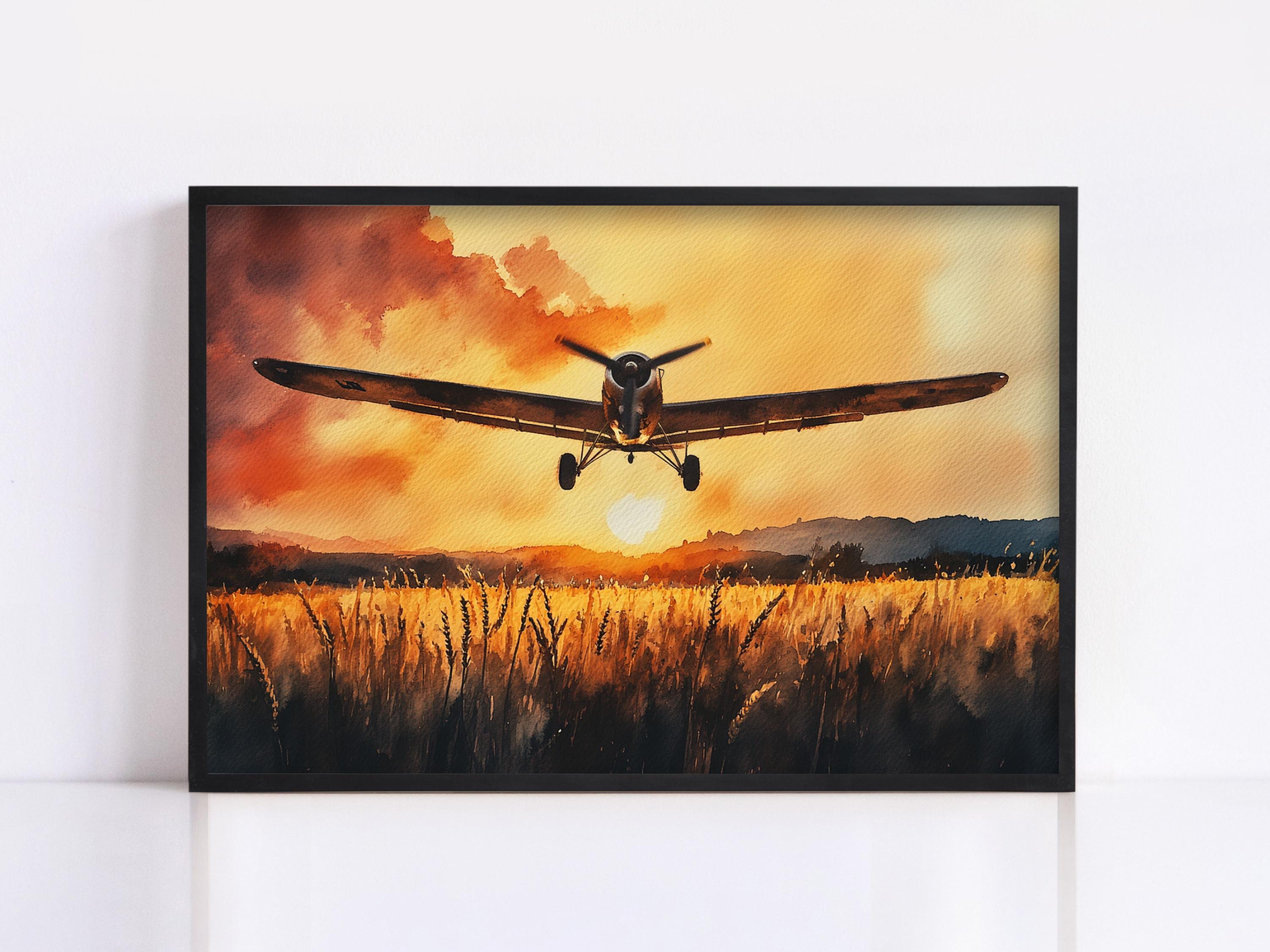 A vintage propeller plane is flying over a field of tall grass at sunset, creating a serene and picturesque scene.