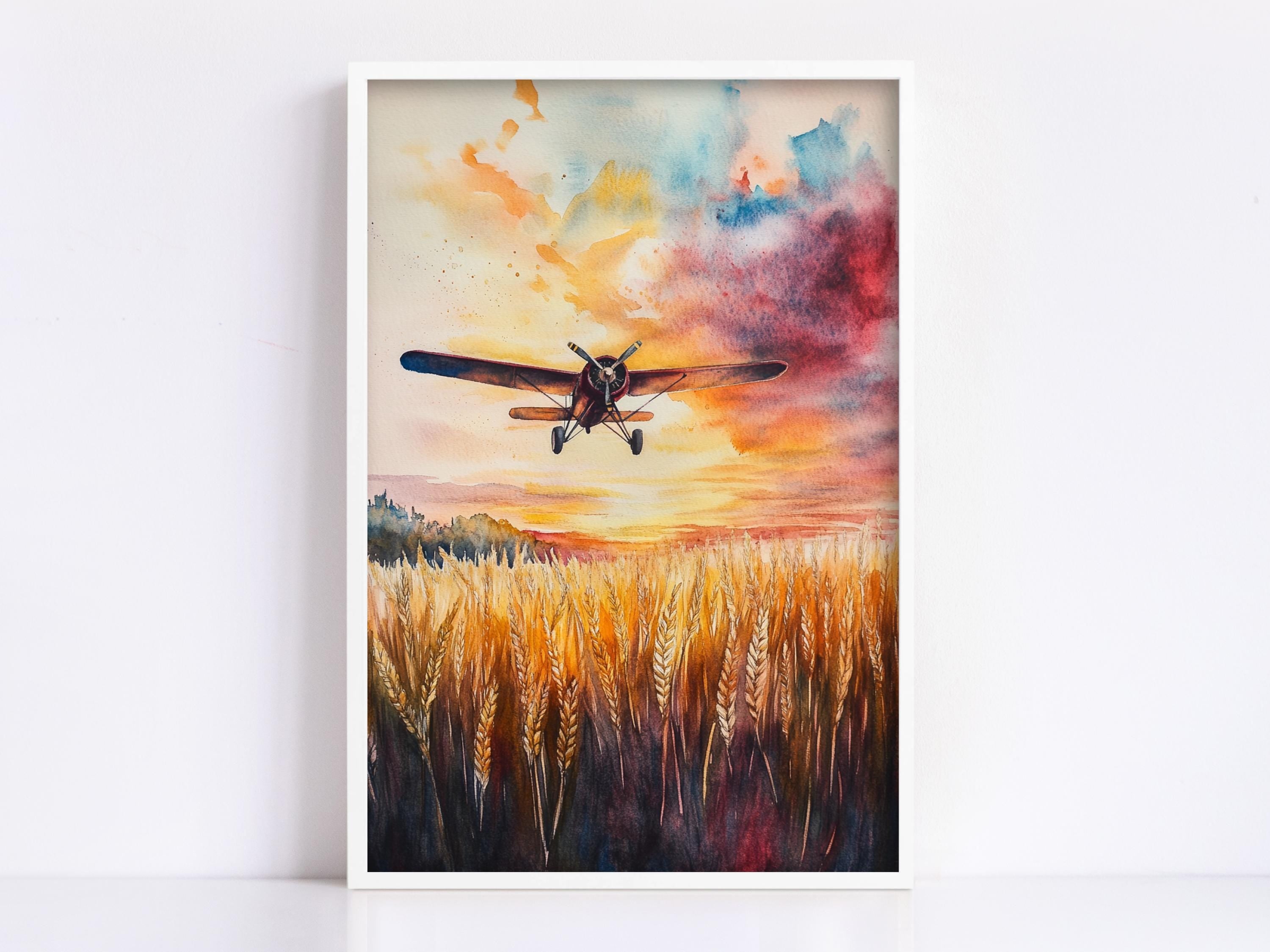 A watercolor painting depicting a small airplane flying over a field of golden wheat against a vibrant sunset sky.