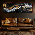a living room with a couch and a painting on the wall