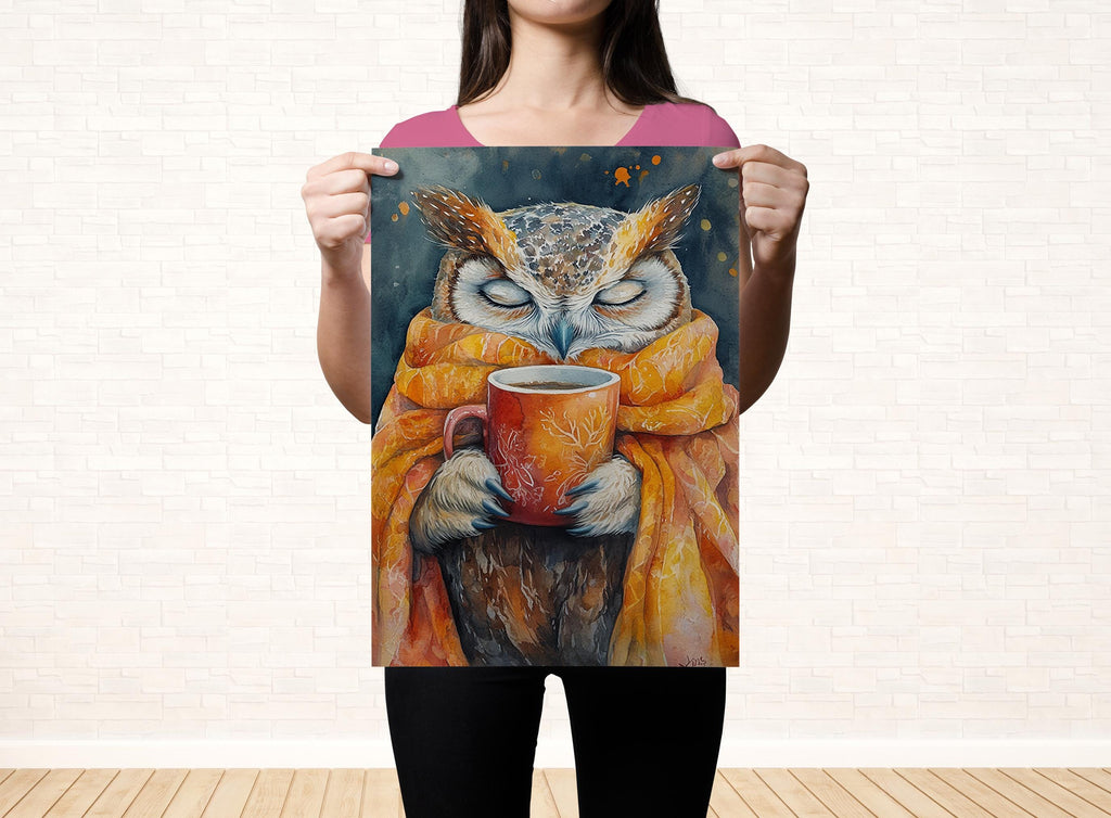 A woman holds up a poster featuring an owl wearing a scarf and holding a mug, with a dark background and a warm, inviting color palette.
