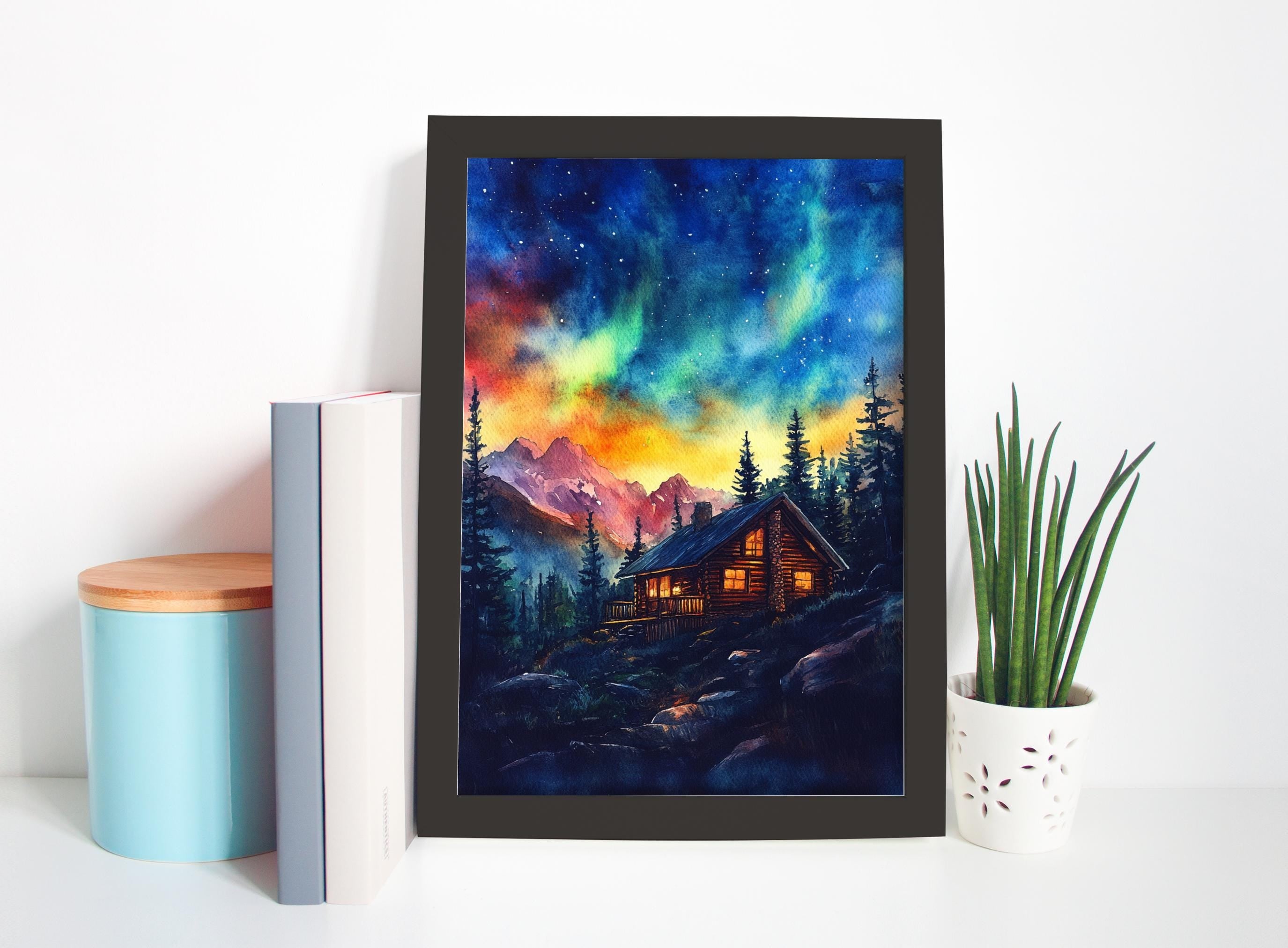 a framed painting of a cabin in a forest, with a night sky filled with stars and a colorful, vibrant display.