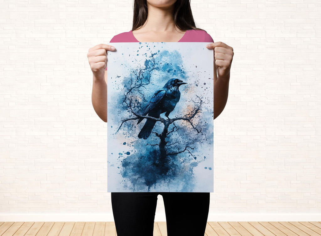 A woman is holding up a framed print of a black bird perched on a tree branch, with a blue and white watercolor-style painting of a tree and bird.