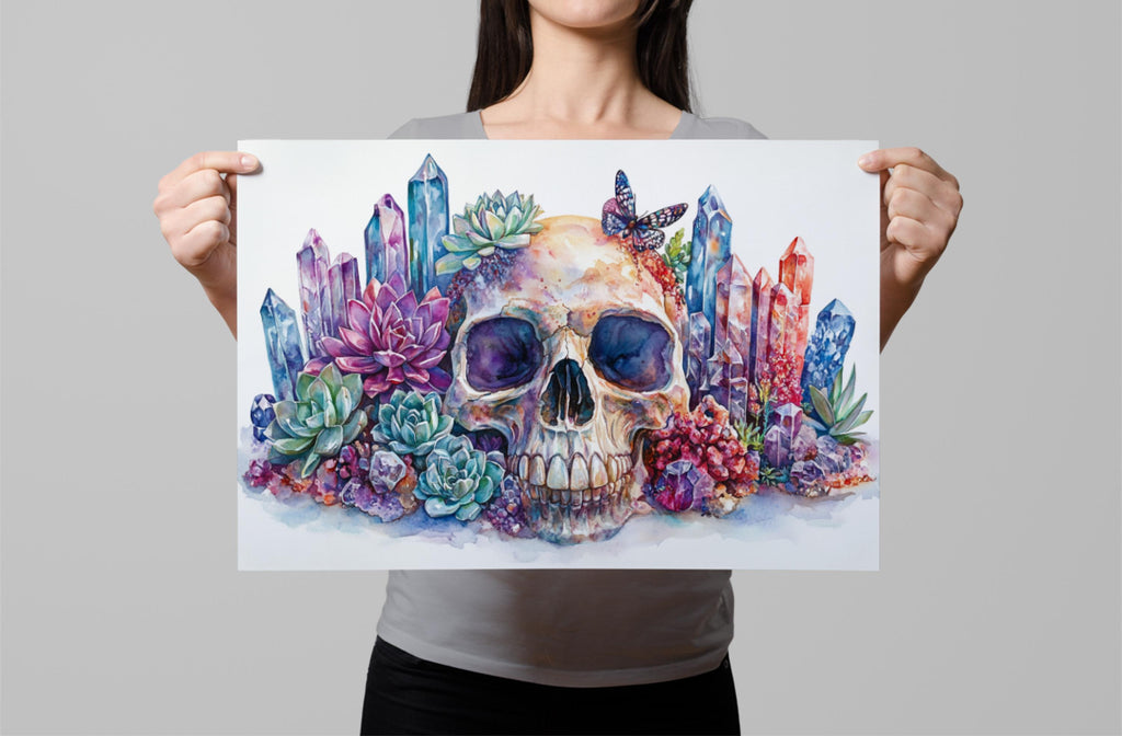 A woman holds up a vibrant, colorful painting depicting a skull surrounded by an array of flowers, plants, and crystals.